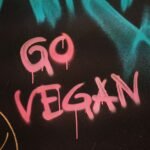 red and white love text with the phrase go vegan on it